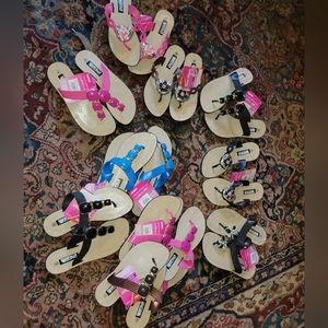Lot of a dozen pairs of new flip flops